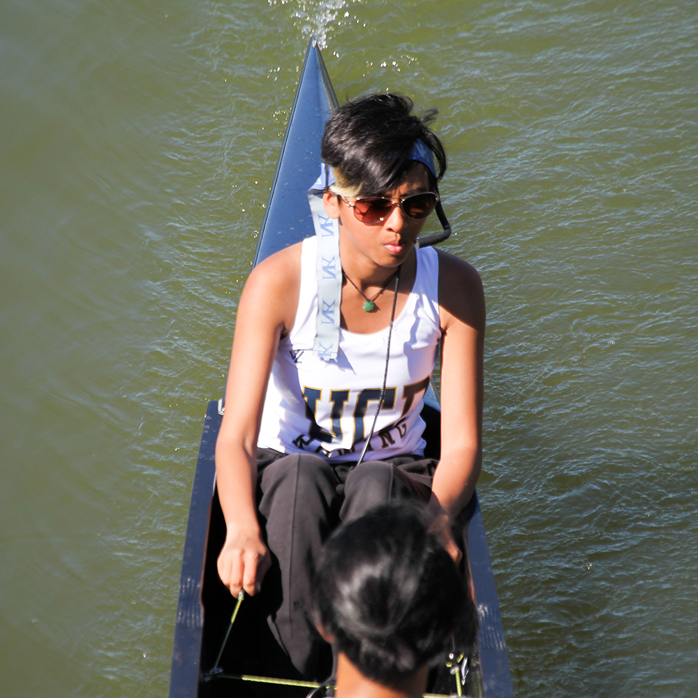 Woman sitting at head of boat