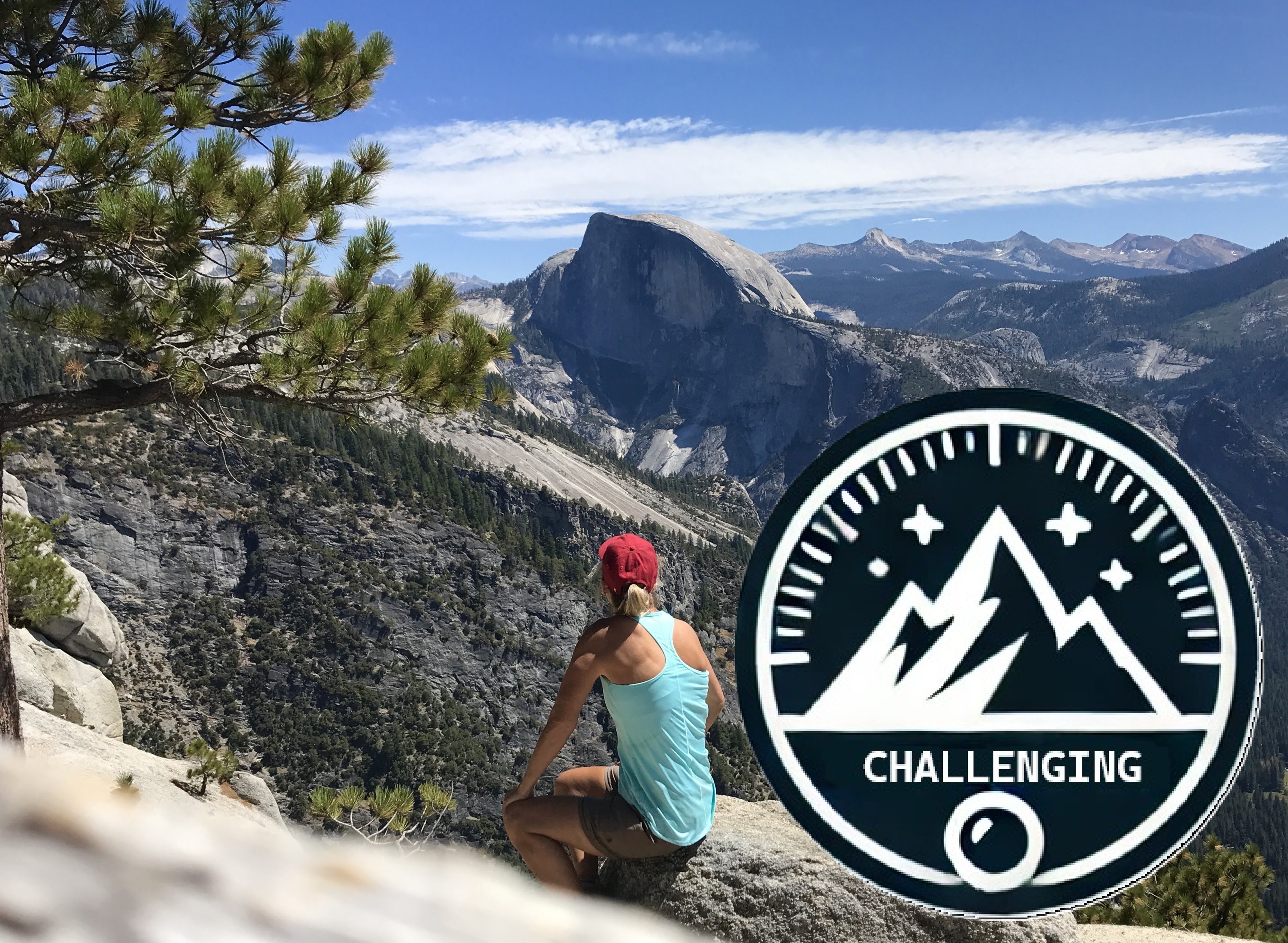 women sitting on a rock outcropping in Yosemite admiring an amazing view