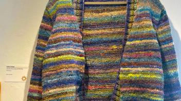 Knit sweater with horizontal rainbow stripes