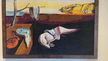 cross stich rendering of Dali's melting clocks