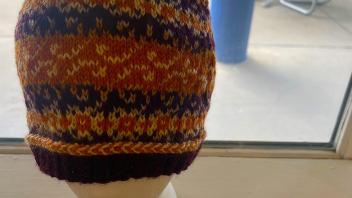 knit hat in earth tones and speckled pattern