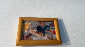 collage of rock climber hanging on an orange slice