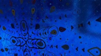 detail view of cobalt blue fused glass panel with pattern