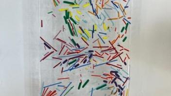 clear and rainbow confetti fused glass panel on wall 