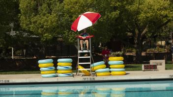 lifeguard next to pool