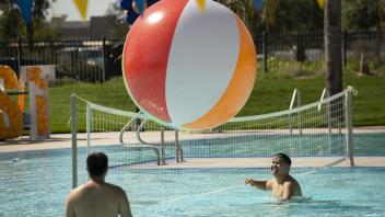 students with large ball in the air