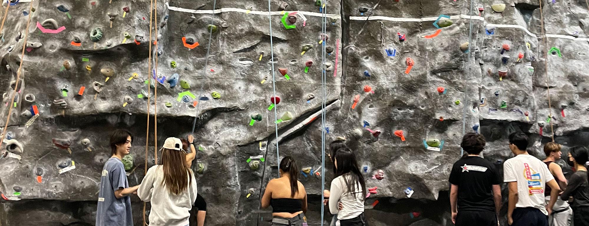 Students at the rock wall at the ARC