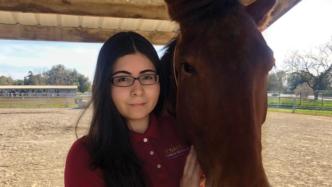Jaritza Granillo posing with a horse
