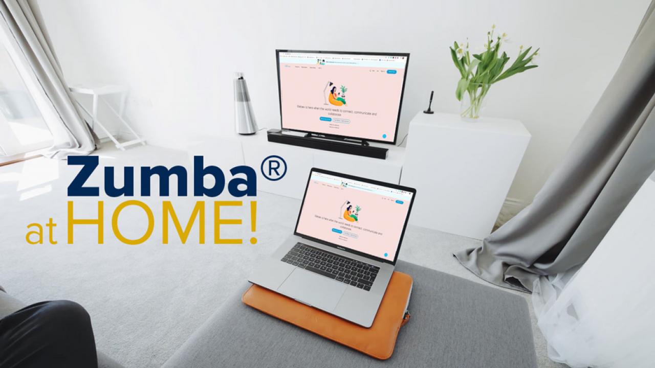 Picture of laptop on couch with text Zumba at Home