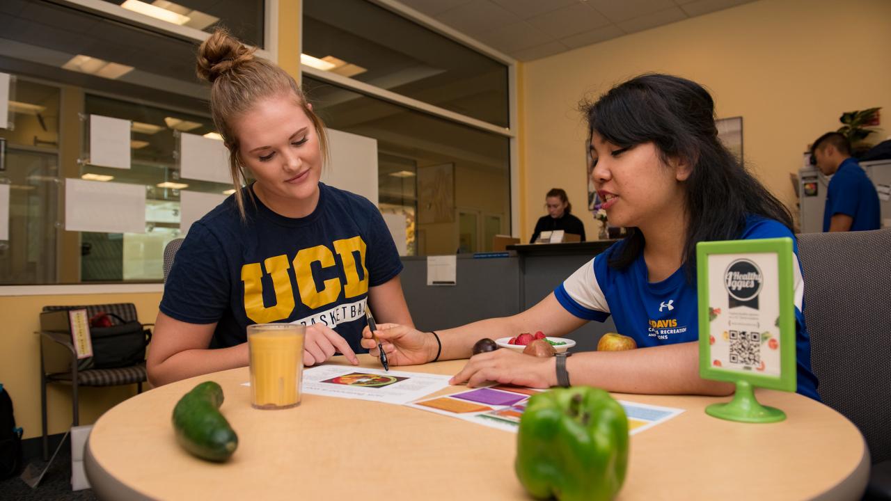 students discussing nutrition services