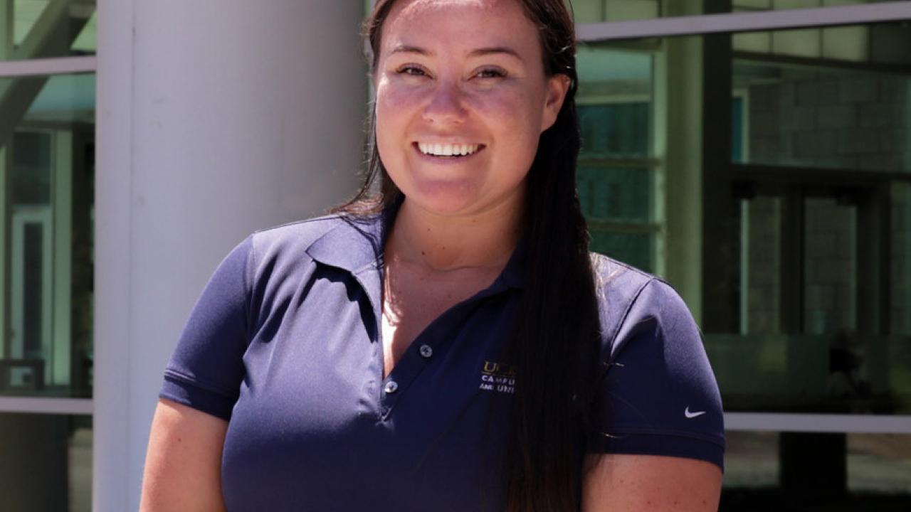 picture of woman, Dr. Shannan Rowe, standing in front of building  