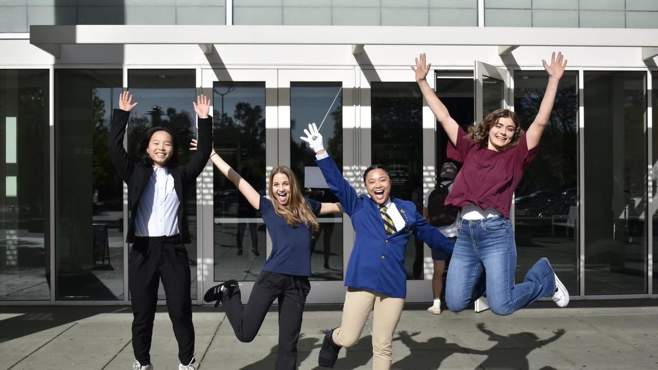 Group of Wasson Award Winners Jump in Front of ARC