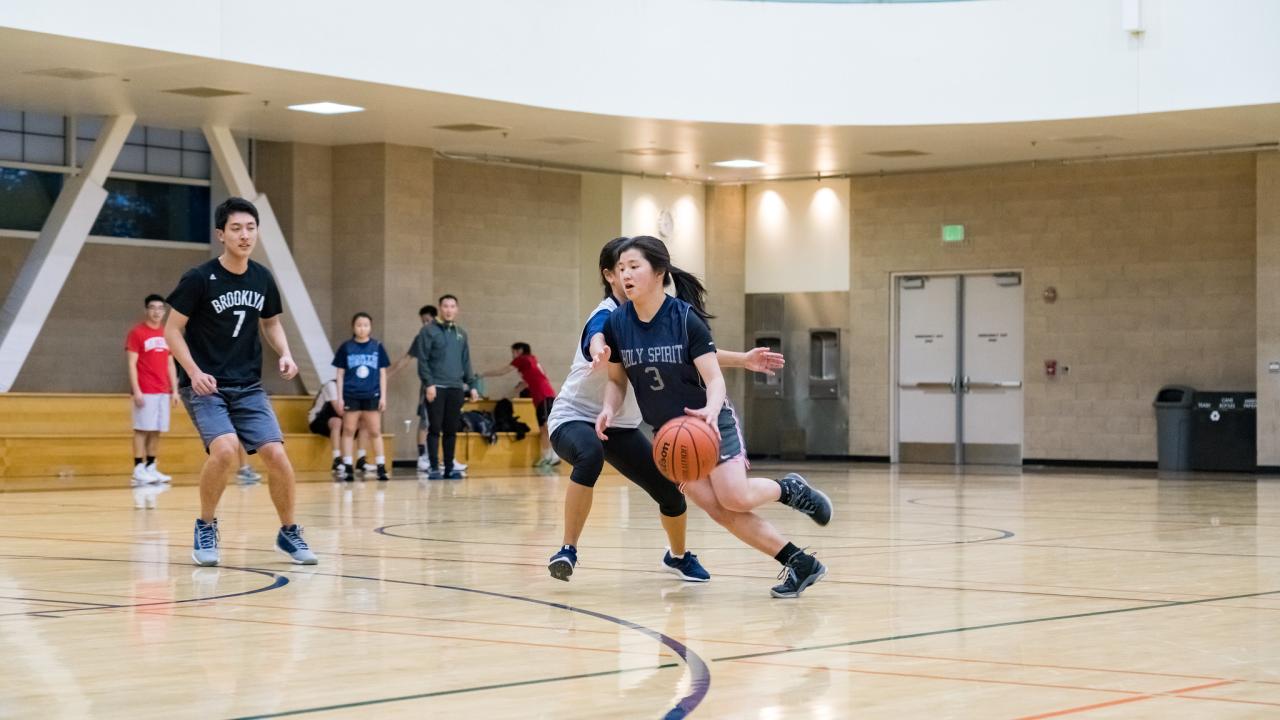 Players playing basketball in the ARC