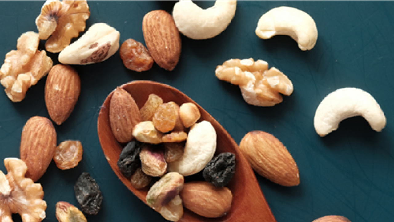A collection of nuts including walnuts, cashews, and almonds. 