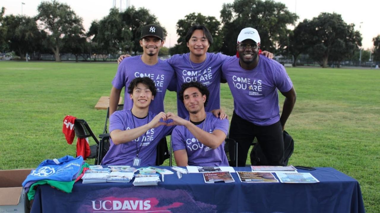 Rec Sports staff pose together by info table