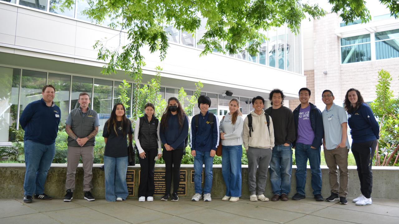 Attendees of the event pose for a group photo
