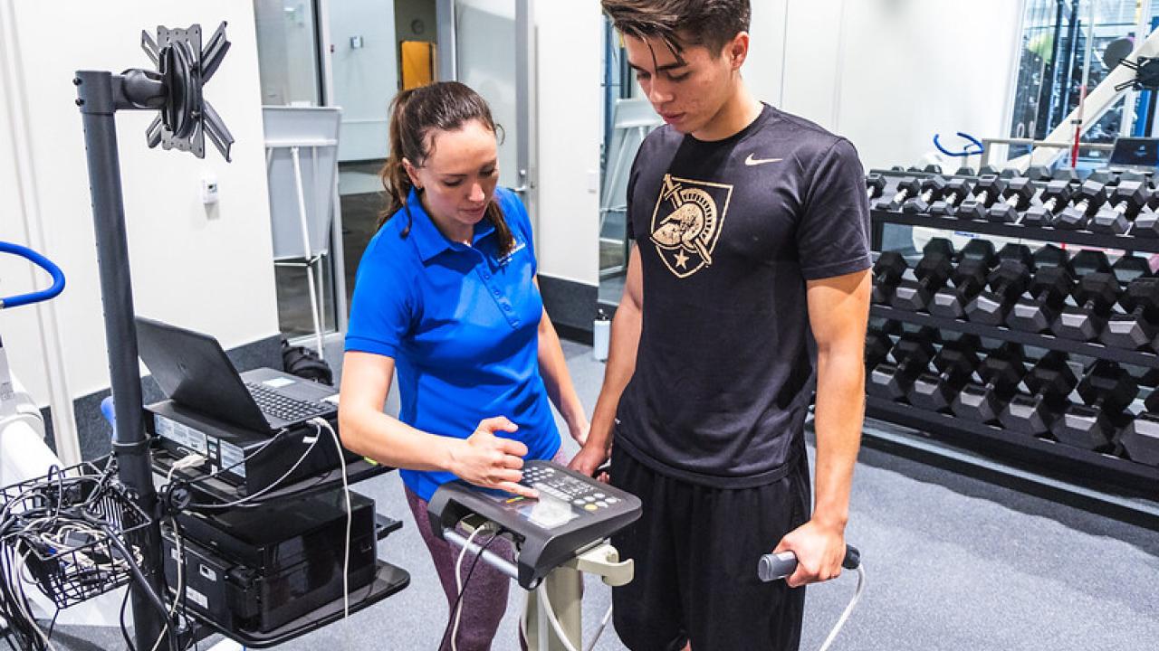 Student and trainer at body composition testing session