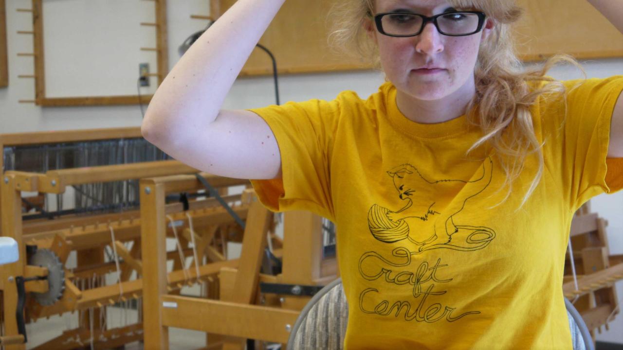 woman with yellow tee wearing roving