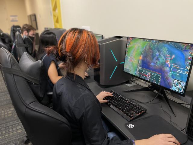 Students playing League of Legends on PC computers in Gunrock Gaming