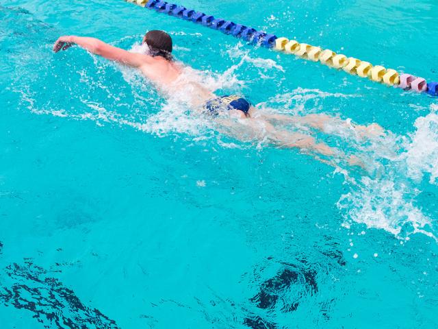 Person swimming laps in a pool