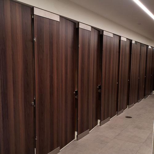 Row of private changing rooms with doors closed