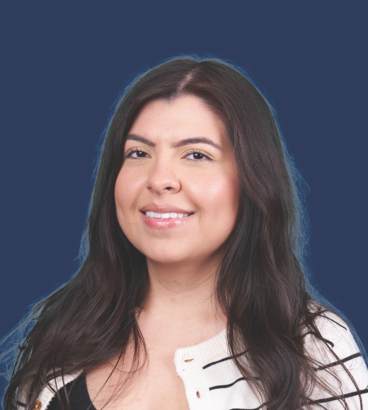 Headshot of Gabbi in front of a blue background