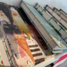 a stack of hand bound books