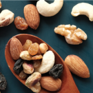 A collection of nuts including walnuts, cashews, and almonds. 