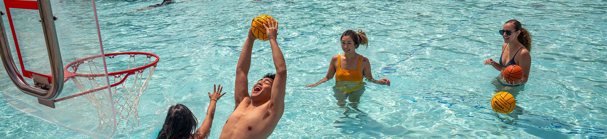 People playing pool basketball