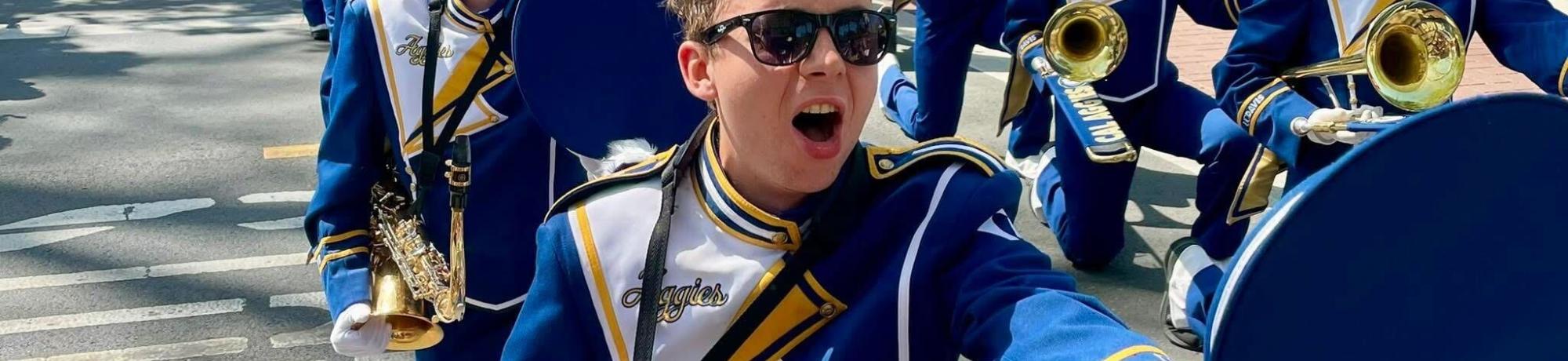 Marching band members playing outside