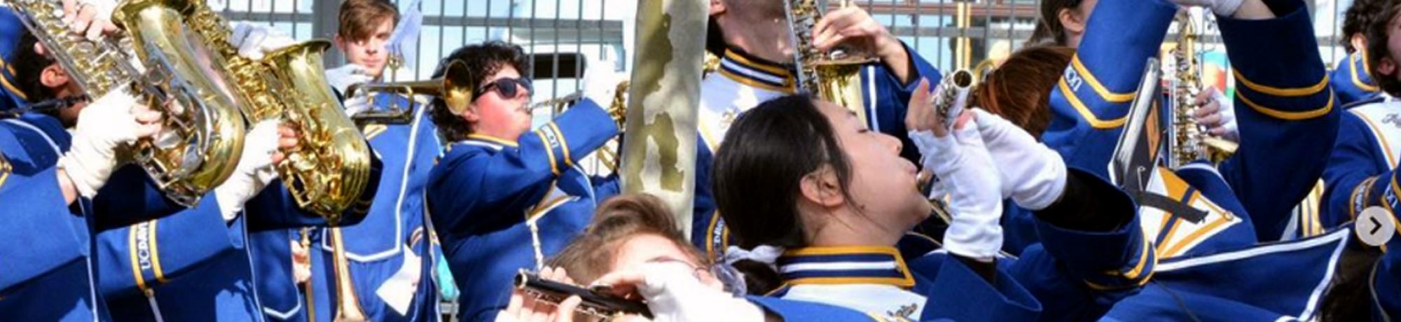 Marching band members playing outside